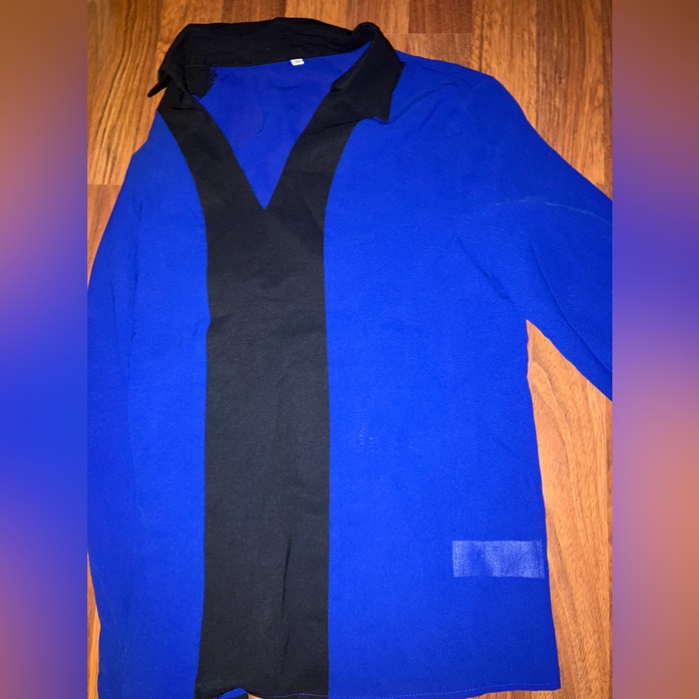 Never worn, blue + black long sleeved shirt.